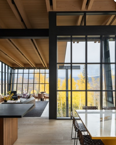 Moving glass wall systems in a modern home with floor-to-ceiling windows in Boise, ID