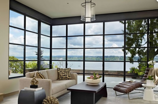 Moving glass wall systems in a modern living room with large window panels in Boise, ID